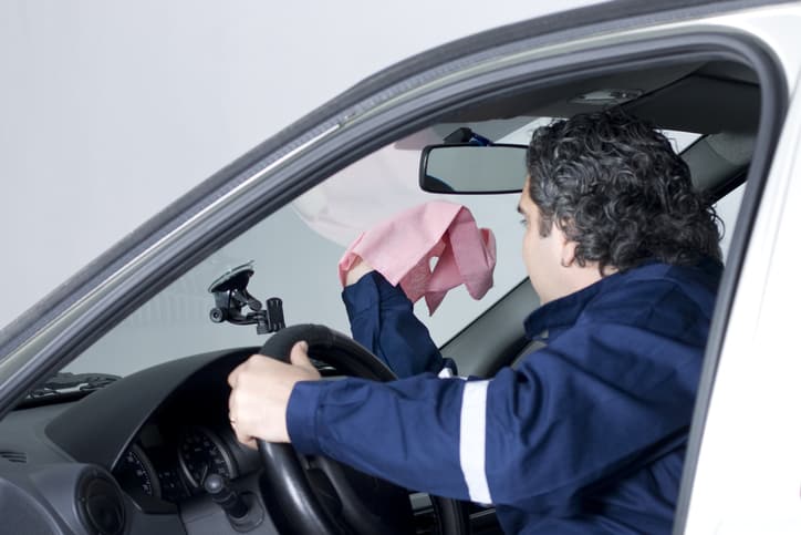 auto-glass-zone-oakville-wiping-inside-of-windshield