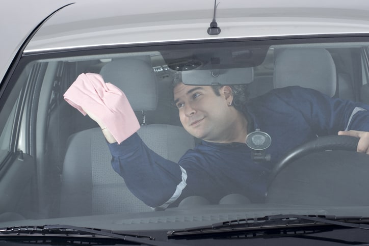 wiping car windshield
