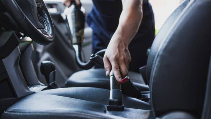 vacuuming a car's interior